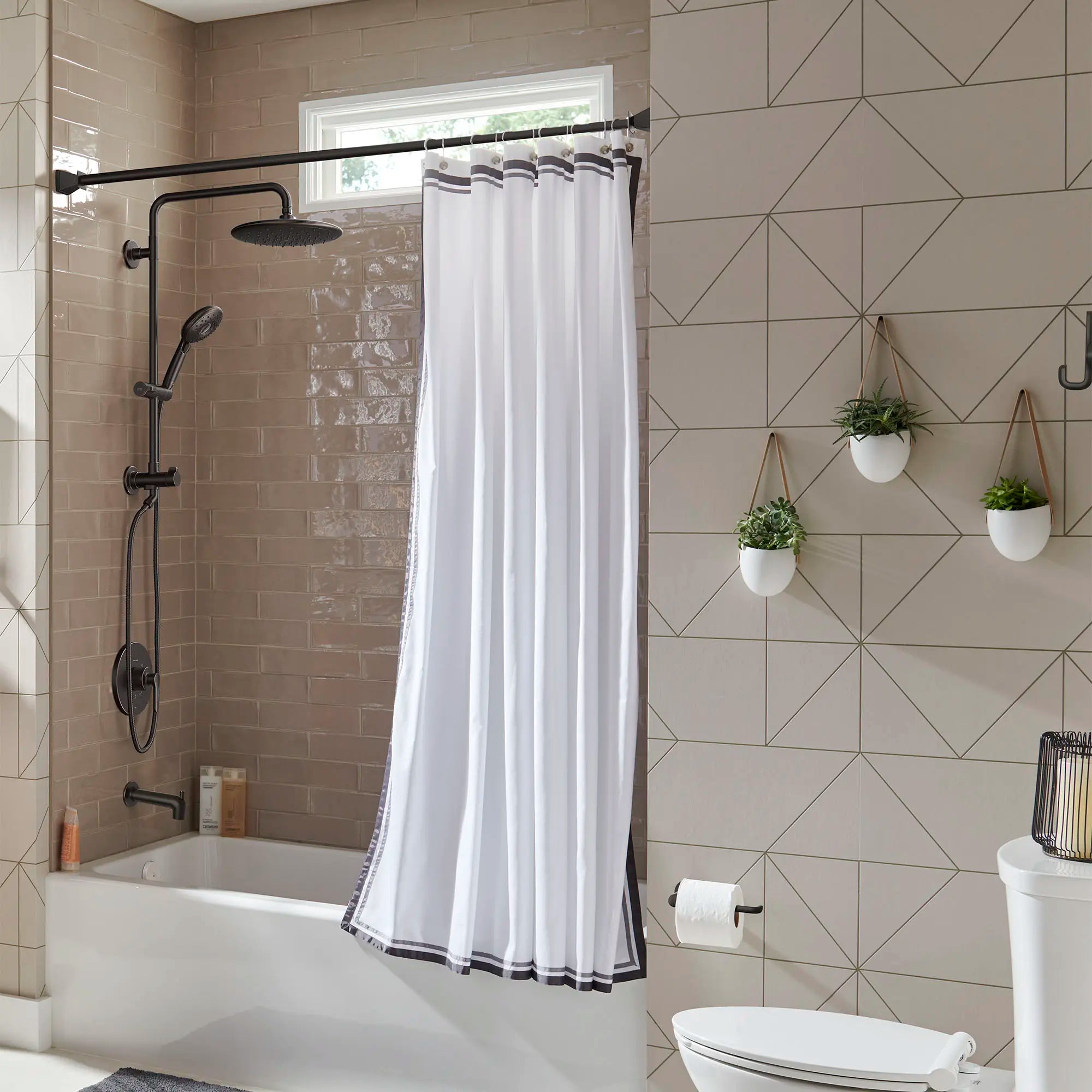 Spectra Versa® 24-Inch 4-Function 1.8 gpm/6.8 L/min Shower System With Rain Showerhead // LEGACY BRONZE // 169559_Spectra_EnvironmentFull_1029072780_0001_Aug2023_0_CDNwebp.webp