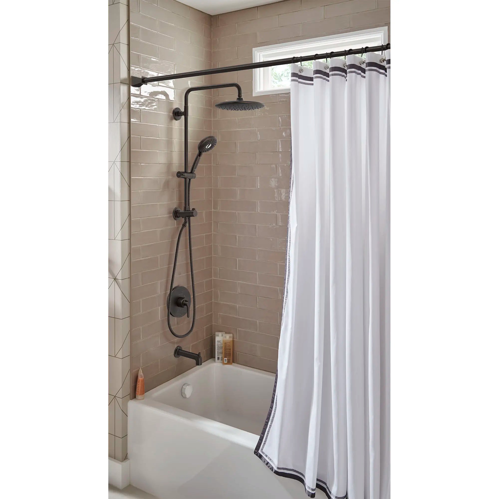 Spectra Versa® 24-Inch 4-Function 1.8 gpm/6.8 L/min Shower System With Rain Showerhead // LEGACY BRONZE // 169560_Spectra_EnvironmentCloseUp_1029072780_0001_Aug2023_0_CDNwebp.webp