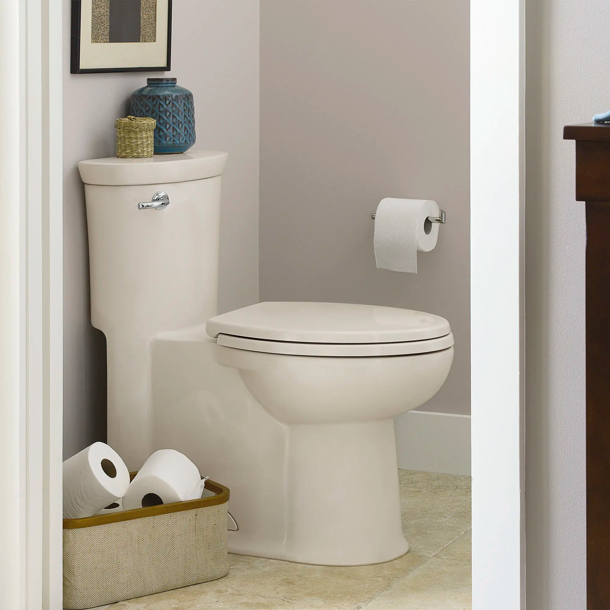 Tropic® One-Piece 1.28 gpf/4.8 Lpf Chair Height Elongated Toilet With Seat // LINEN // 174493_B-2786128222_04_0_CDNwebp.webp