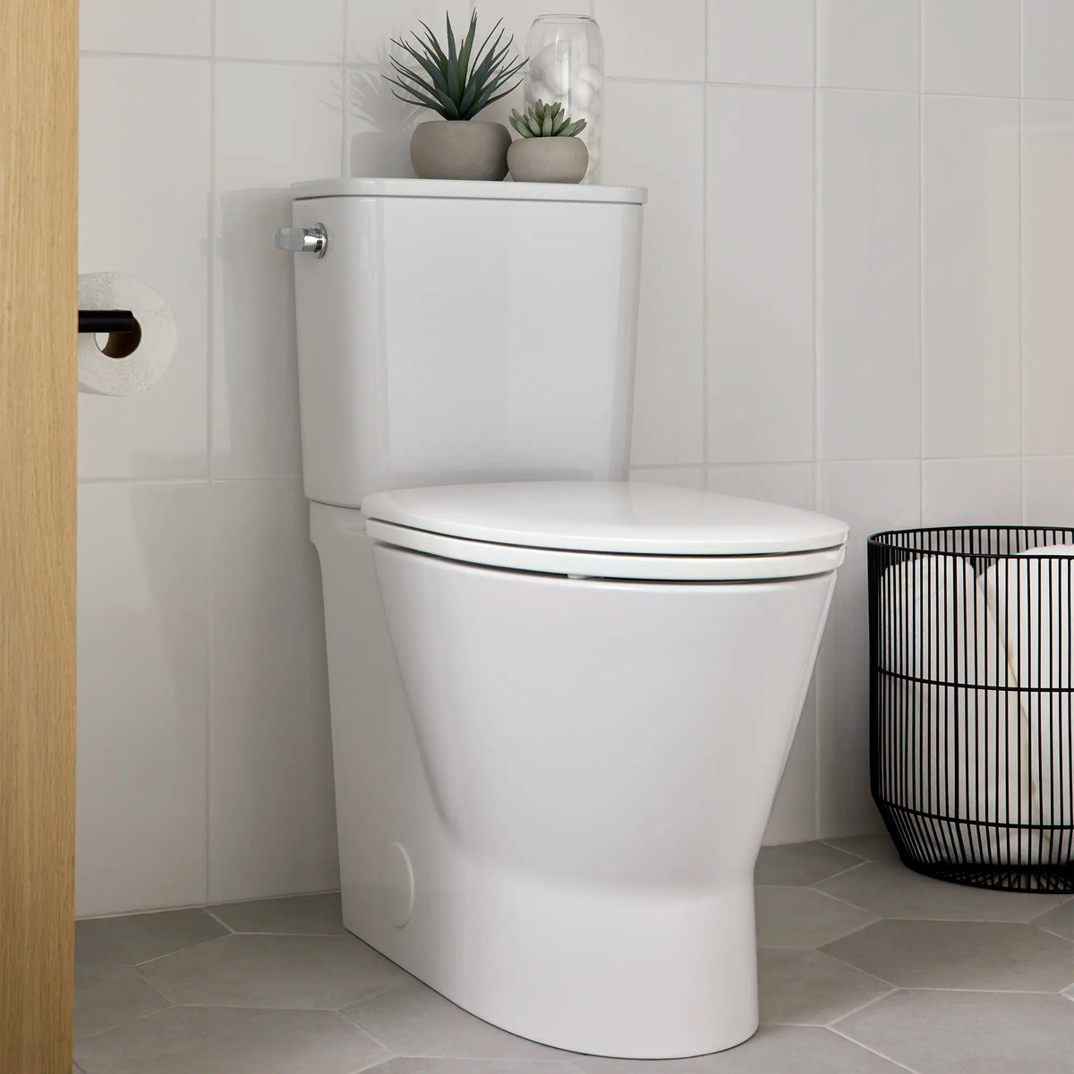 Cadet® Aspirations Skirted Two-Piece 1.28 gpf/4.8 Lpf Chair-Height Elongated Toilet With Seat // LEFT / WHITE // 232108_Aspirations_EnvironmentCloseUp_252AA899.020_0002_Nov2023_CDNwebp.webp