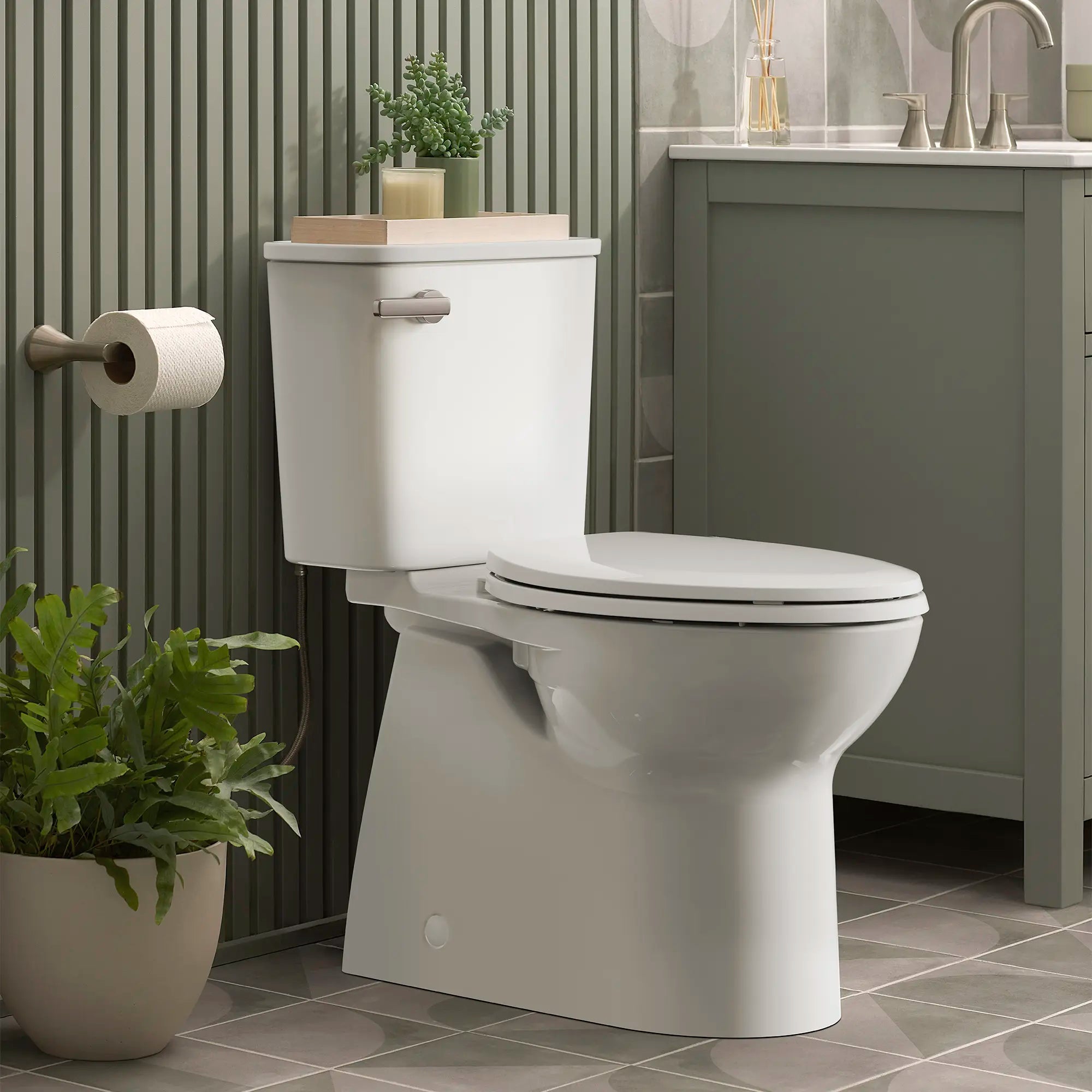 Aspirations Skirted Two-Piece 1.28 gpf/4.8 Lpf Chair-Height Elongated Toilet With Seat // WHITE // 237594_Aspirations_EnvironmentCloseUp_785AA801.020_0001_Jan2024_1_CDNwebp.webp