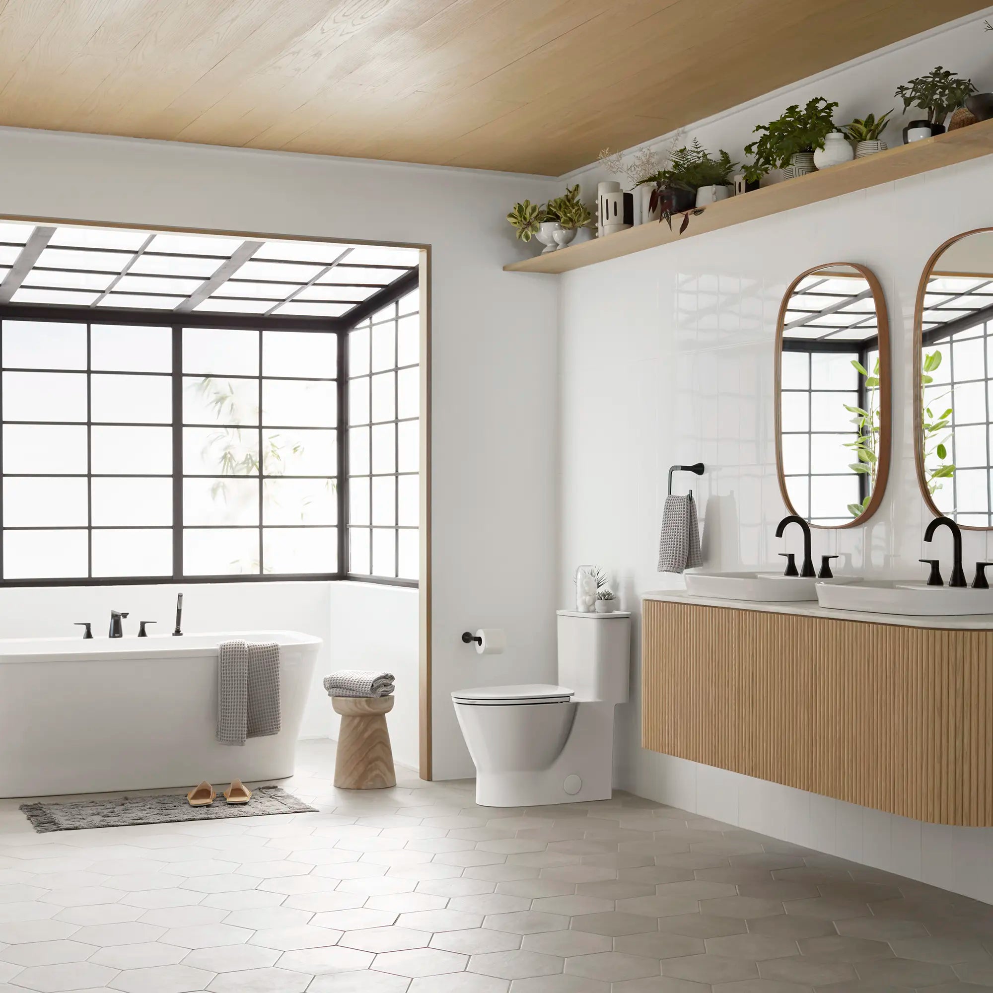 EcoStrength Aspirations Skirted One-Piece 0.80 gpf/3.0 Lpf Chair Height Elongated Toilet With Seat // WHITE // 237869_Aspirations_Ecostrength_EnvironmentFull_2828A809.020_0002_FEBRUARY2024_CDNwebp.webp