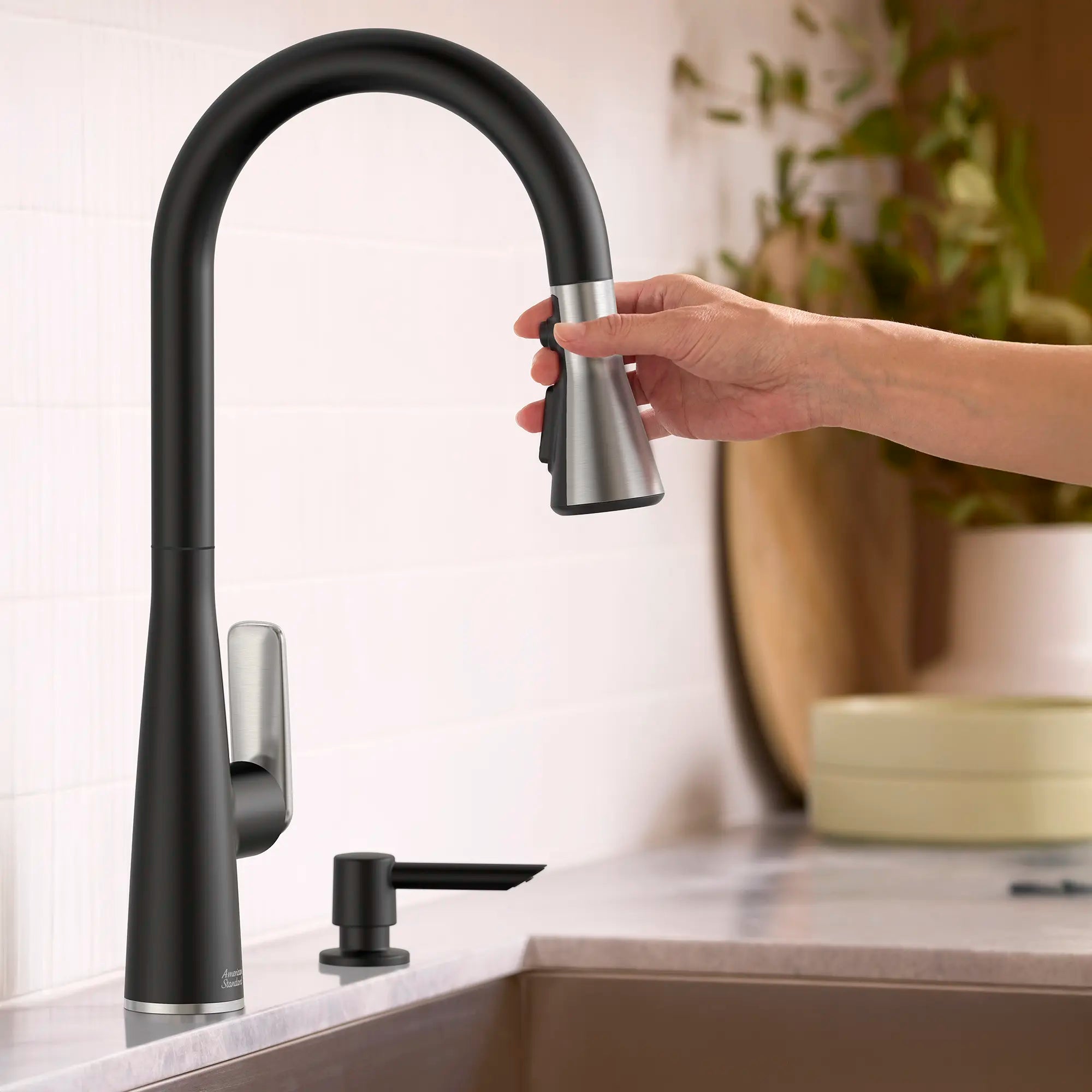 Aspirations Pull-Down Kitchen Faucet // MATTE BLACK/STAINLESS STEEL // 263729_Aspirations_EnvironmentCloseUp_1048814230_0001_APRIL2025_0_CDNwebp.webp
