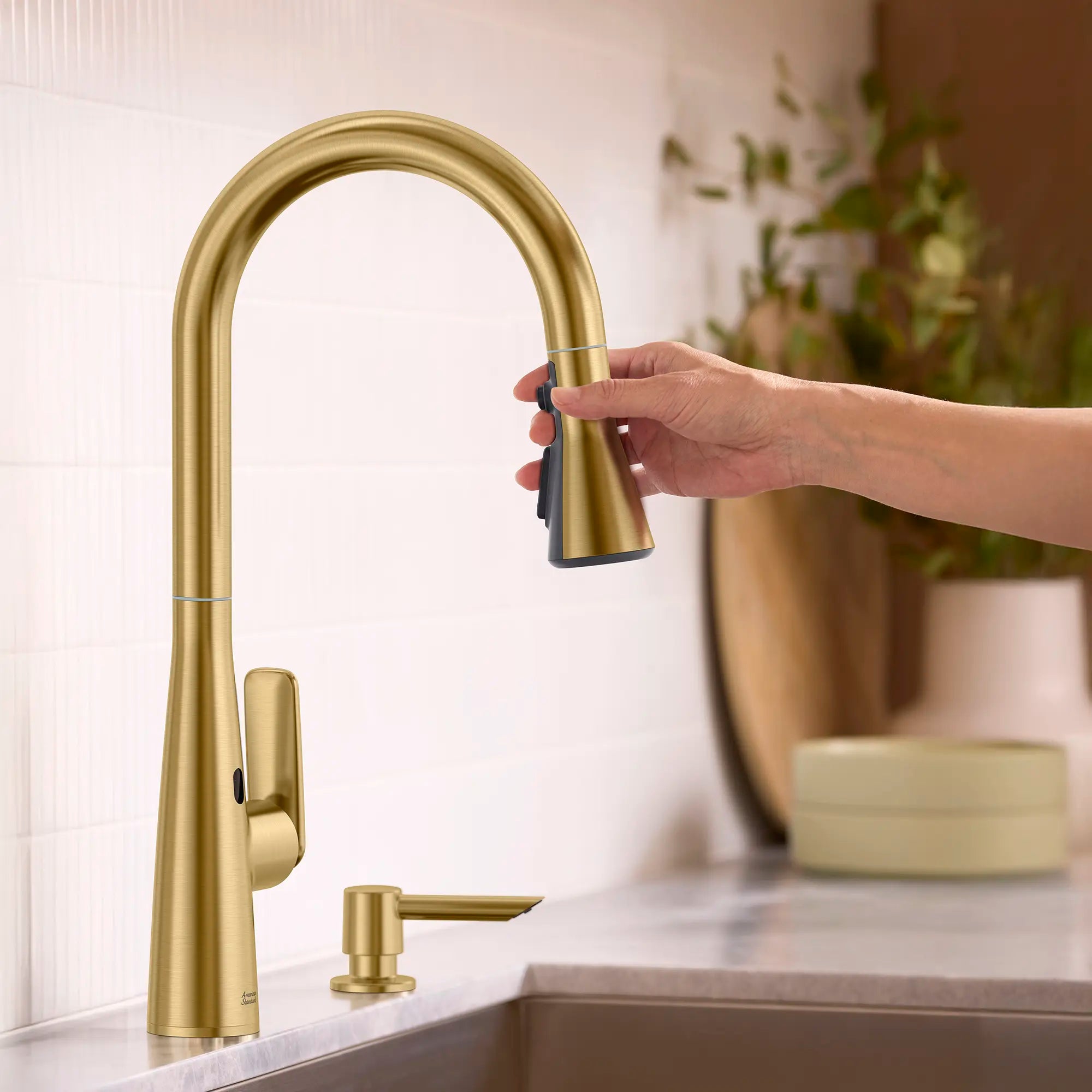 Aspirations Touchless Pull-Down Kitchen Faucet // BRUSHED COOL SUNRISE // 263738_Aspirations_EnvironmentCloseUp_104880GN00_0004_MAY2025_0_CDNwebp_db54bef3-7cbe-44ef-95ea-a29a9971b46d.webp
